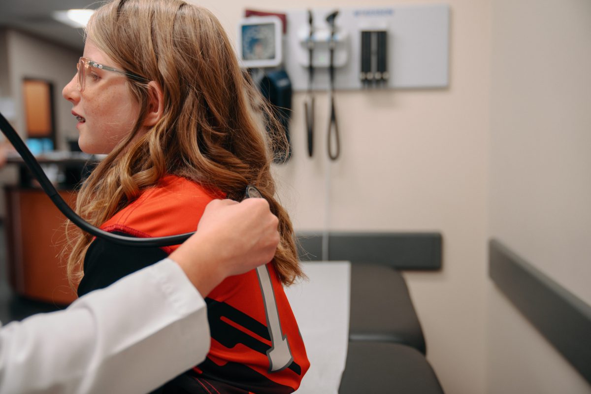 Young Girl in Sports Jersey Getting Physical at AFC
